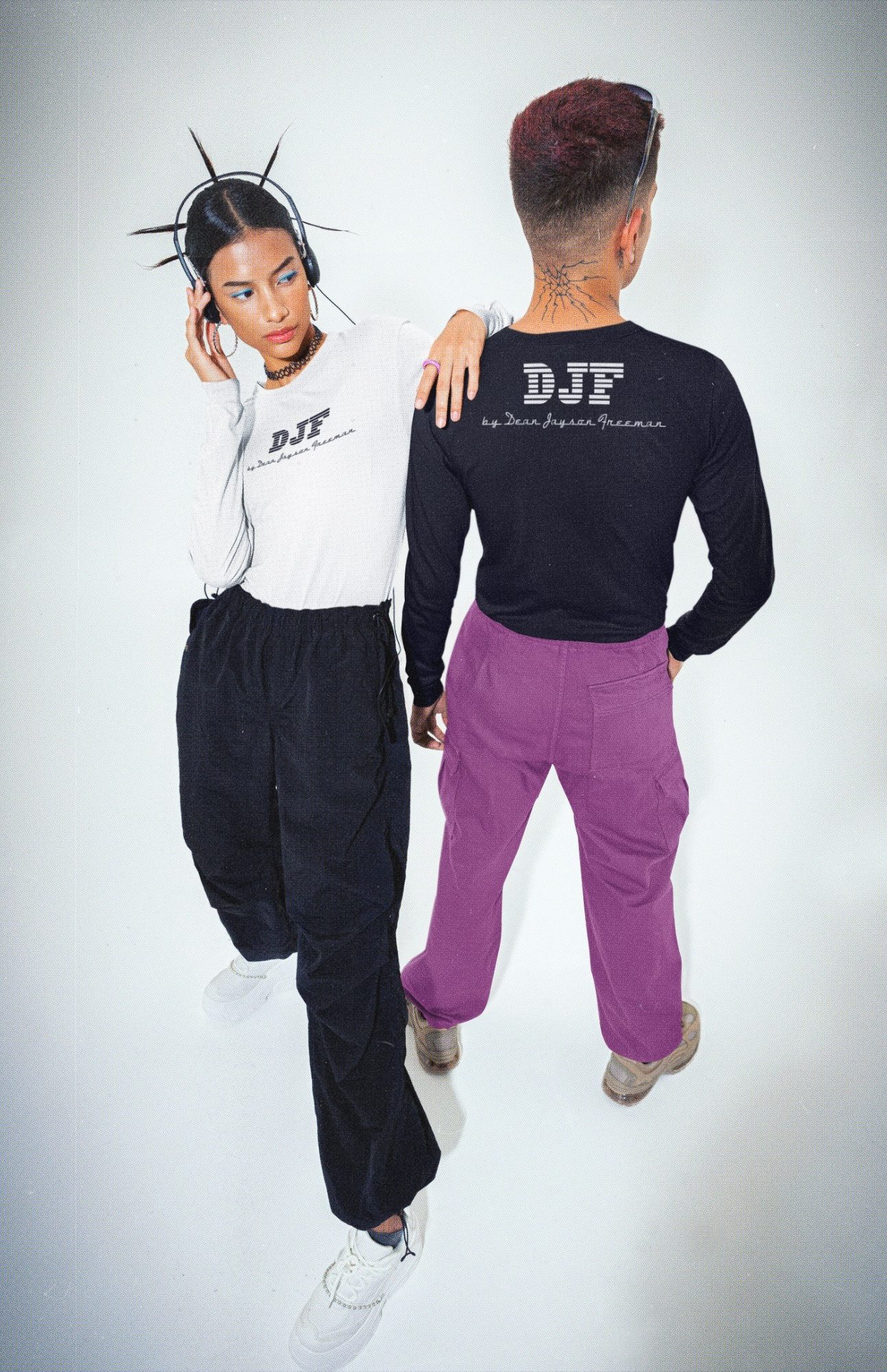 Zwei stylische Personen in moderner DJF by Dean Jayson Freeman Kleidung, eine mit Stachelhaar, die anderen in lila Hose.